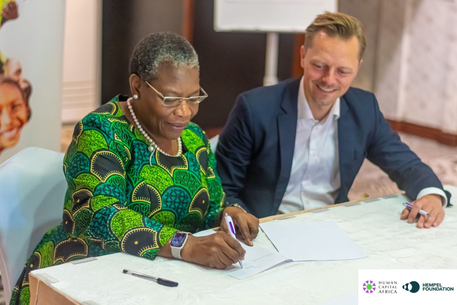 Dr Obiageli “Oby” Ezekwesili signs the partnership agreement