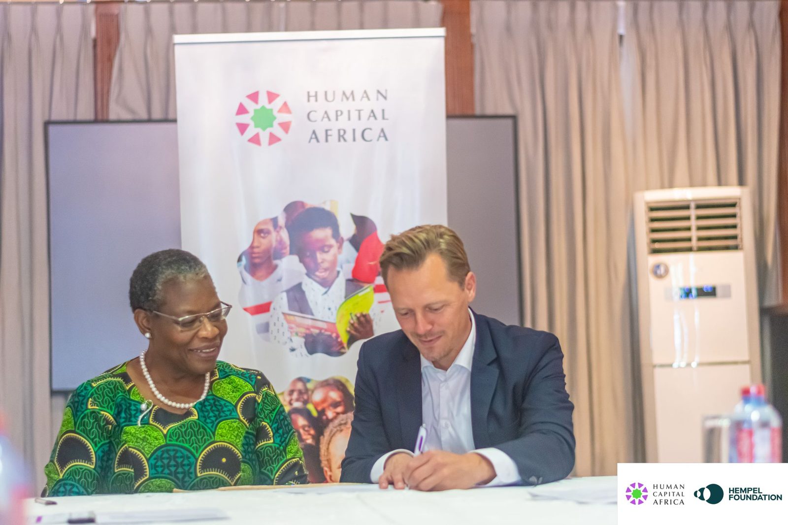 Dr Obiageli “Oby” Ezekwesili and a Hempel Foundation representative sign the partnership agreement